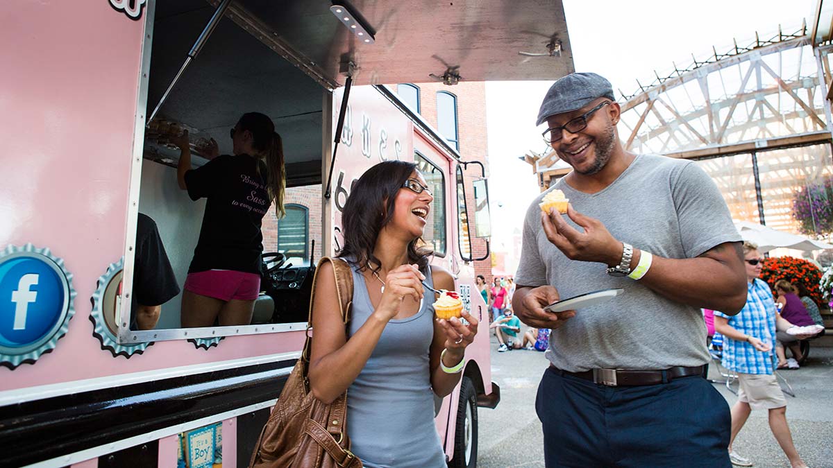 Visitors enjoy the downtown food truck scene in the streets of Buffalo, NY.