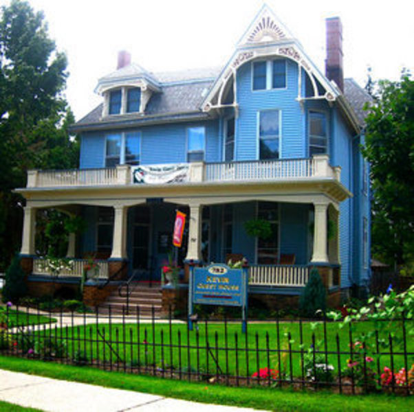 Exterior shot of the ornate and blue Kevin Guest House in Buffalo, NY