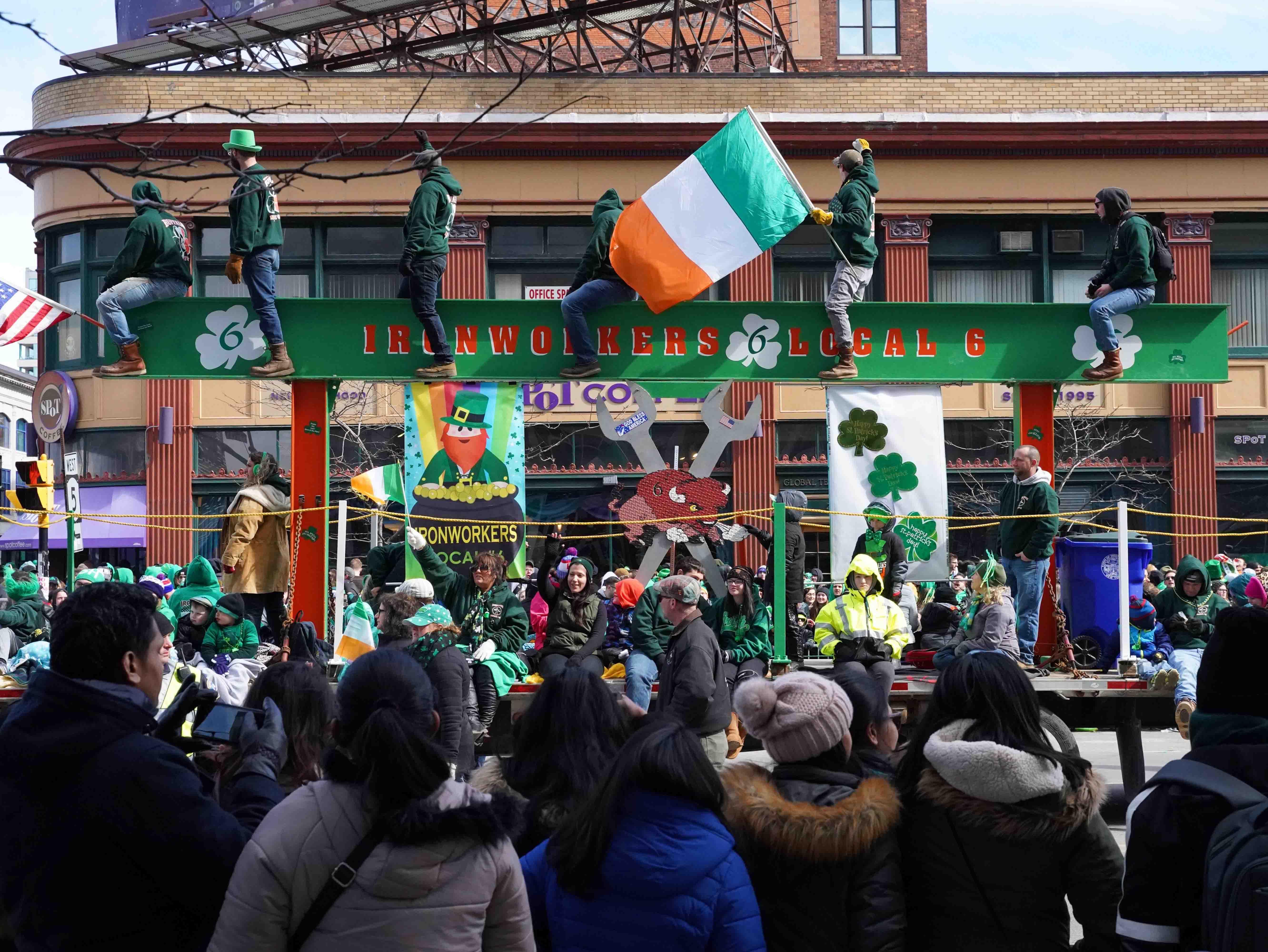 Spectators celebrate Saint Patrick's Day outside spot coffee in Buffalo, NY.