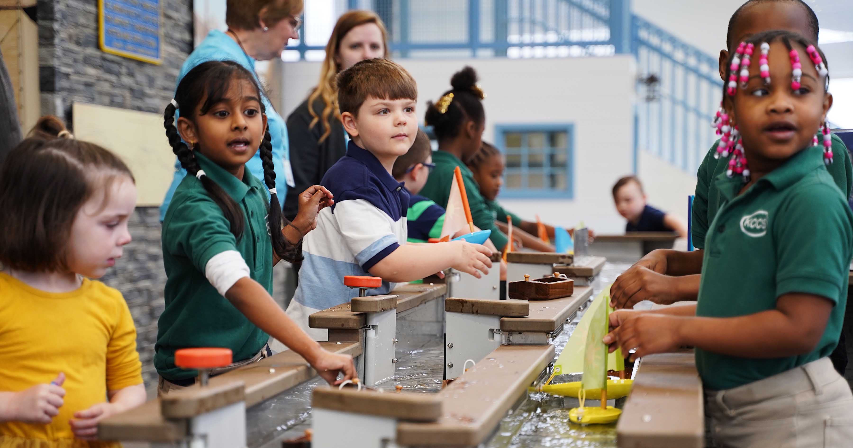 Explore & Children making boats at More Children's Museum