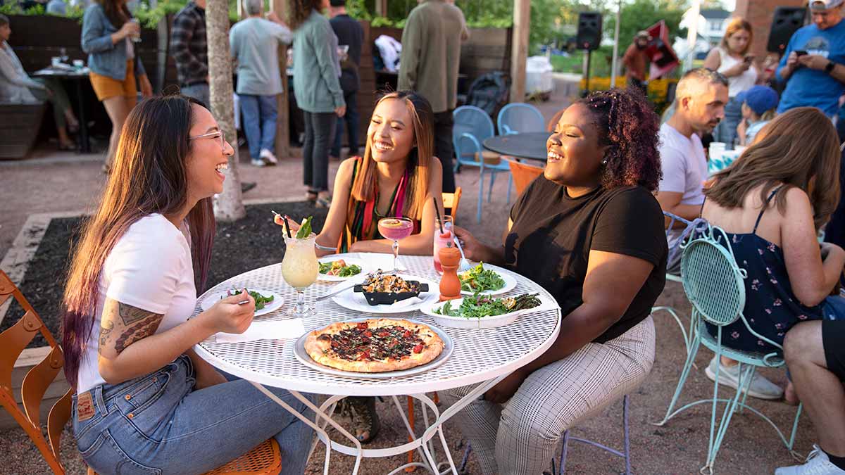 A group eating outside at Hydraulic Hearth in Buffalo, NY