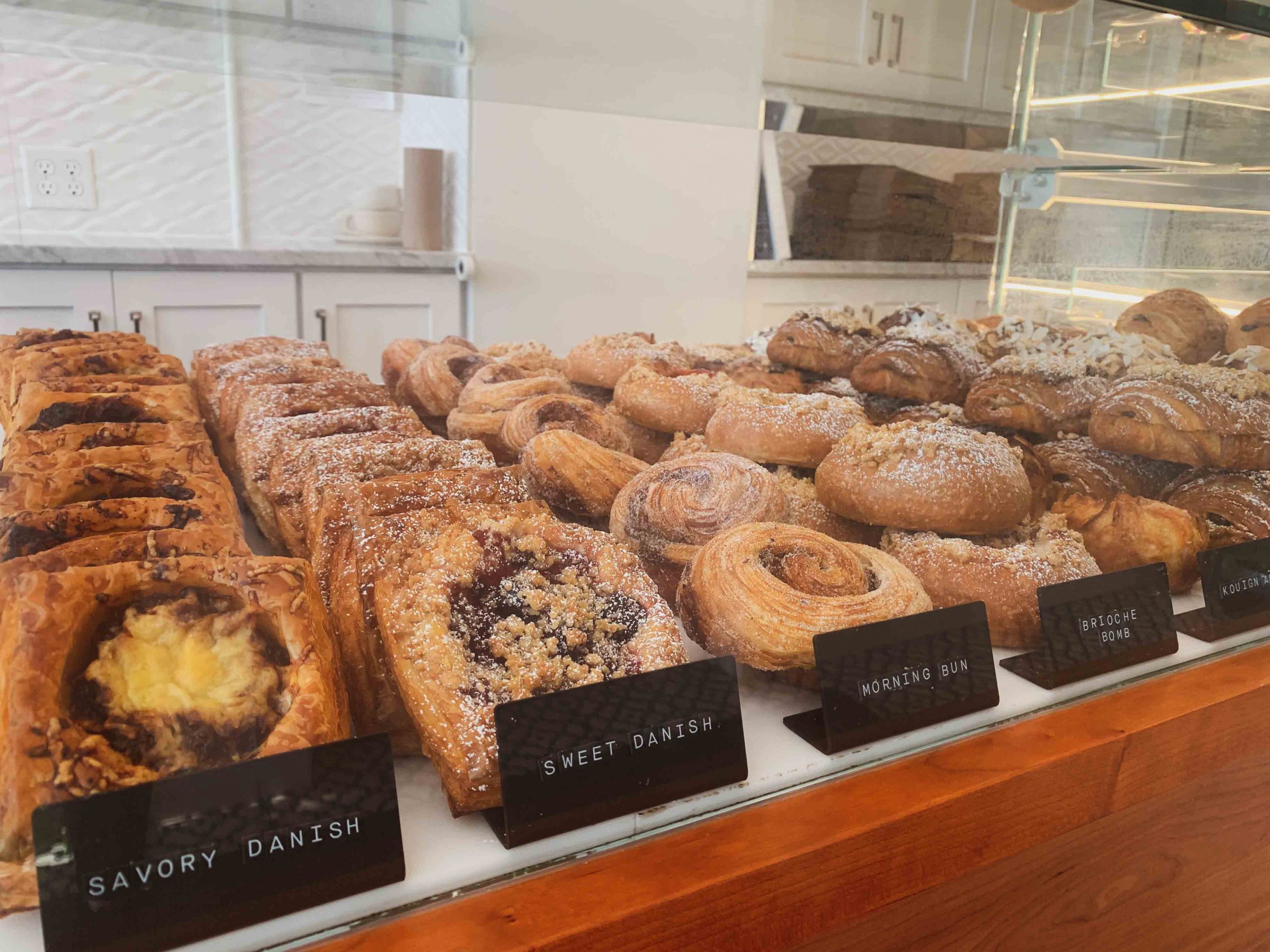 A bakery display case filled with pastries at Butter Block in Buffalo, NY