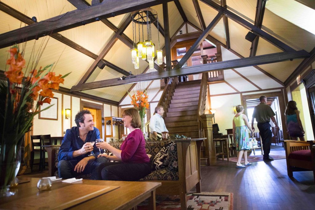 Guests share laughs and drinks during a spacious stay in East Aurora near Buffalo, NY.