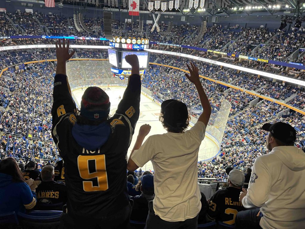 Fans cheering on the Buffalo Sabres NHL team at KeyBank Center