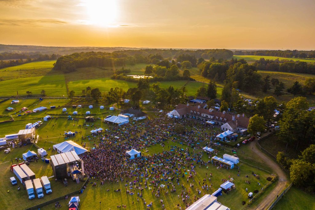 An aerial photo of a sunset over Borderland Music + Arts Festival and Knox Farm State Park.