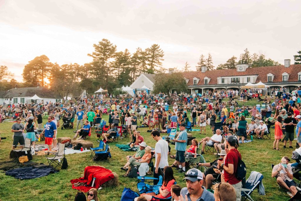 A photo of a crowd of people watching live music on the lawn at Borderland Music + Arts Festival.